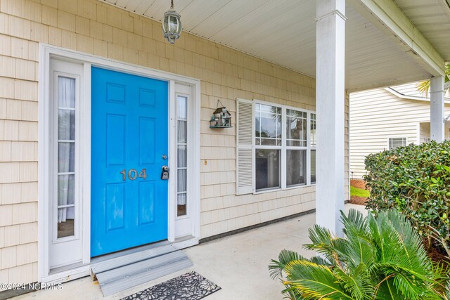 doorway to property with covered porch