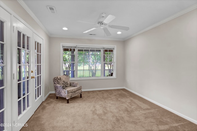 unfurnished room with ceiling fan, light colored carpet, ornamental molding, and french doors