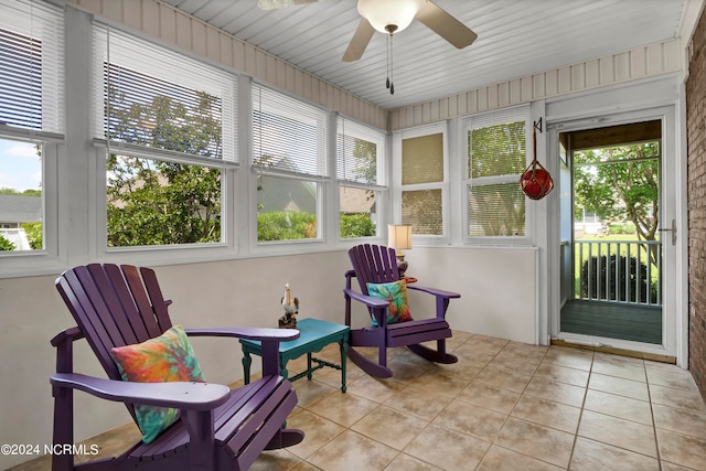 sunroom / solarium with ceiling fan and a wealth of natural light