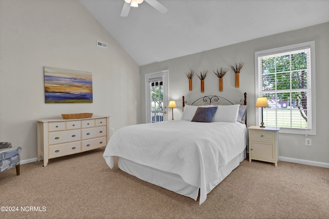 carpeted bedroom with ceiling fan, high vaulted ceiling, and multiple windows