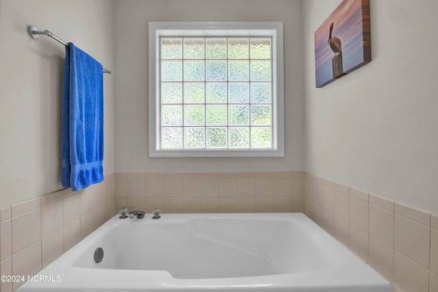 bathroom with tiled bath