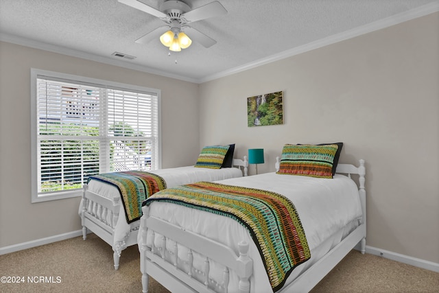 bedroom with carpet flooring, ceiling fan, a textured ceiling, and multiple windows