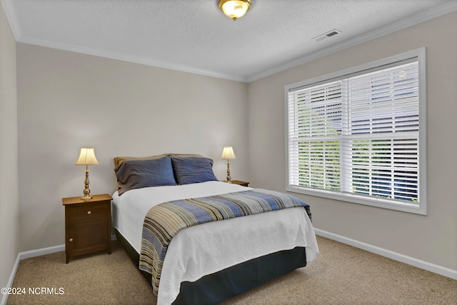 carpeted bedroom featuring ornamental molding and a textured ceiling