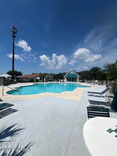 view of pool with a patio