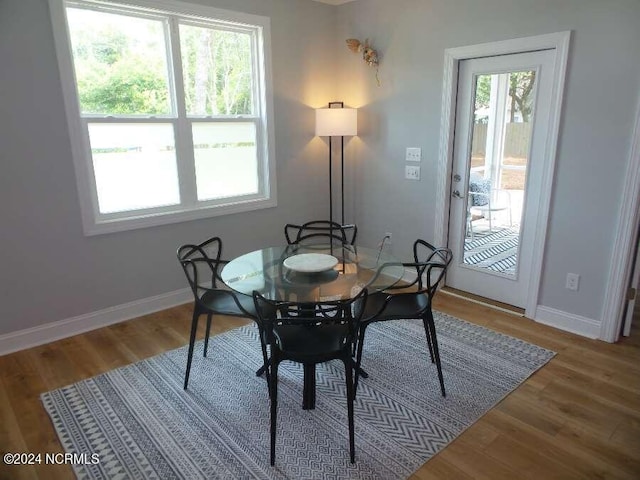 dining room with hardwood / wood-style flooring