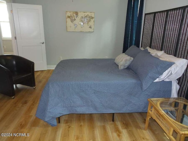 bedroom with wood finished floors