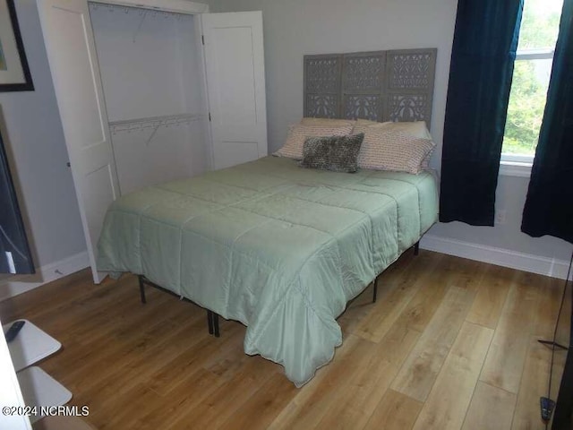 bedroom featuring a closet and hardwood / wood-style floors