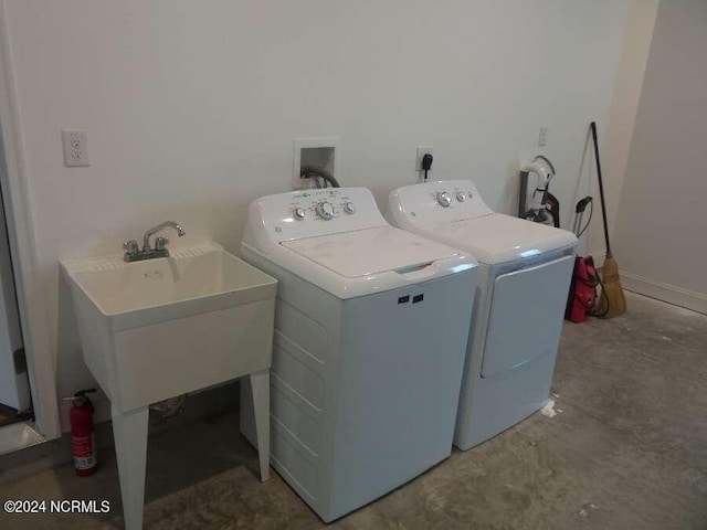 clothes washing area featuring hookup for a washing machine and washer and clothes dryer