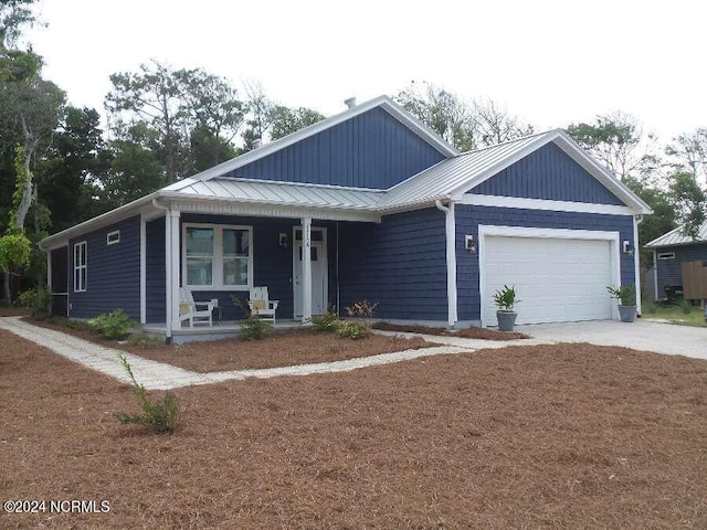 view of front of property with a garage and a porch