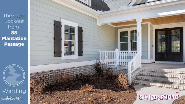 entrance to property featuring french doors and a porch