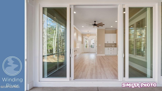 view of exterior entry with ceiling fan