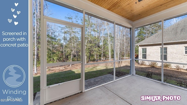 unfurnished sunroom with a wealth of natural light and wood ceiling