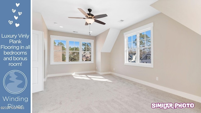 additional living space featuring light colored carpet, vaulted ceiling, and ceiling fan