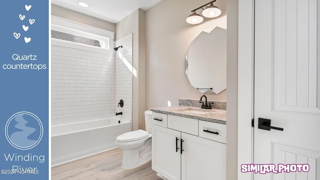 full bathroom featuring shower / tub combination, vanity, wood-type flooring, and toilet