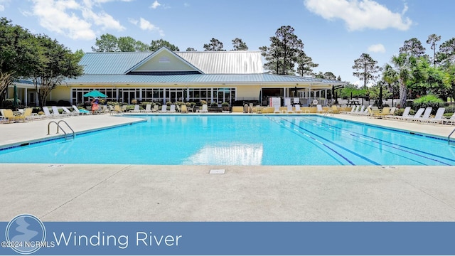 view of pool featuring a patio area