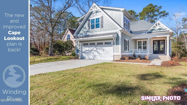 view of front facade featuring covered porch, a garage, a front yard, and french doors