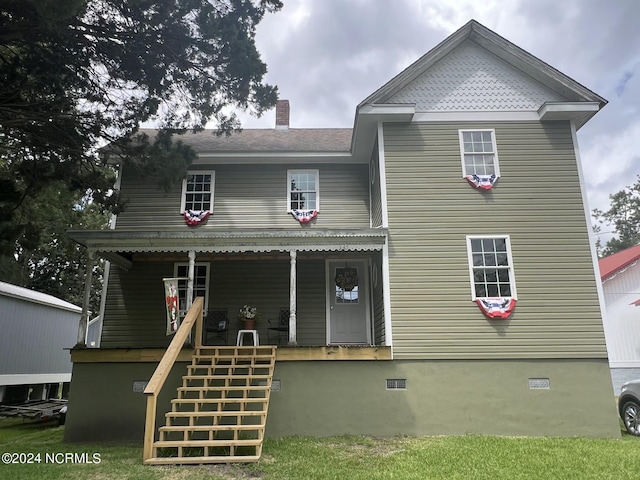 view of front of home with stairs, a porch, and crawl space