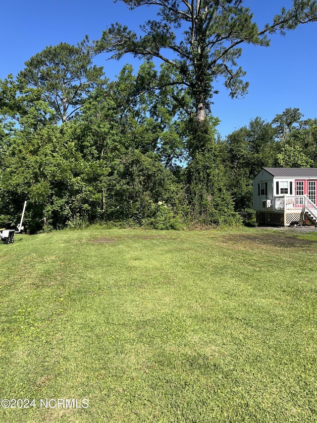 view of yard with a wooden deck