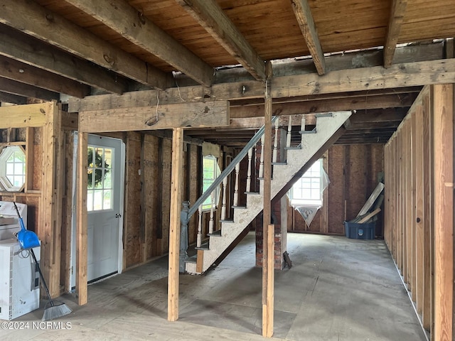 basement featuring stairs and a wealth of natural light