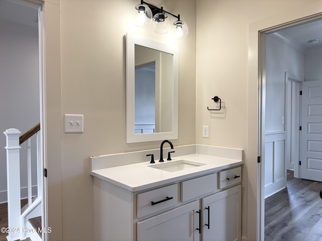 bathroom with vanity and hardwood / wood-style flooring