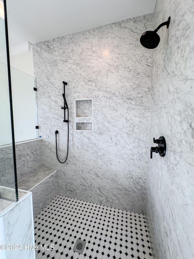 bathroom featuring tiled shower