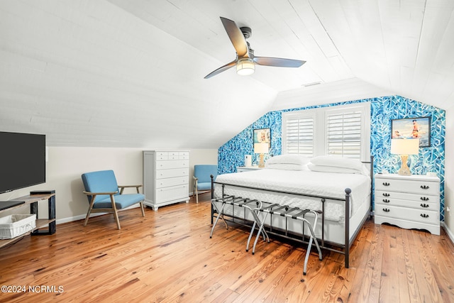 bedroom featuring hardwood / wood-style flooring, lofted ceiling, and ceiling fan