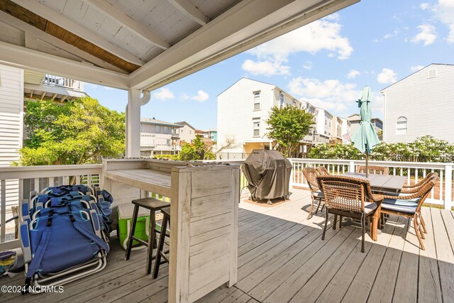 wooden terrace with area for grilling