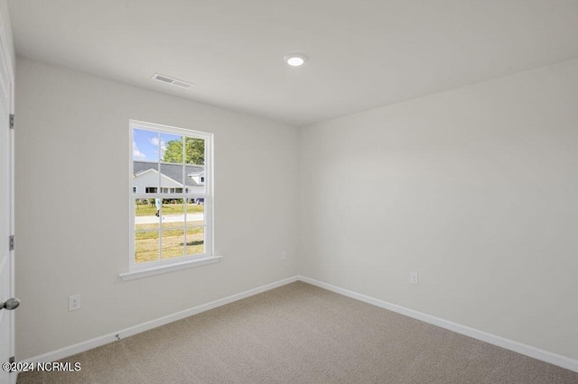 spare room featuring carpet