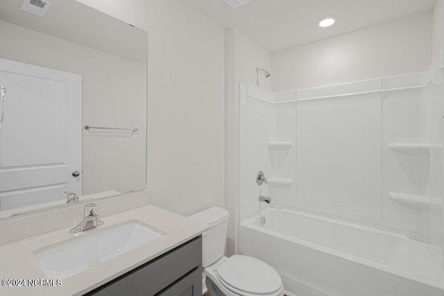 full bathroom with vanity, shower / bath combination, and toilet