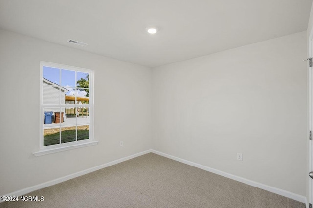 empty room with carpet flooring