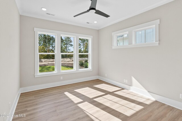 1105 Trisail Ter, Wilmington, NC 28412 - unfurnished room featuring wood finished floors, baseboards, ceiling fan, recessed lighting, and crown molding