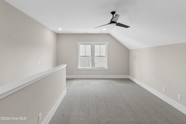 bonus room featuring light carpet, ceiling fan, and vaulted ceiling