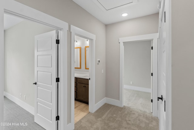 1105 Trisail Ter, Wilmington, NC 28412 - hallway with light colored carpet, baseboards, and recessed lighting