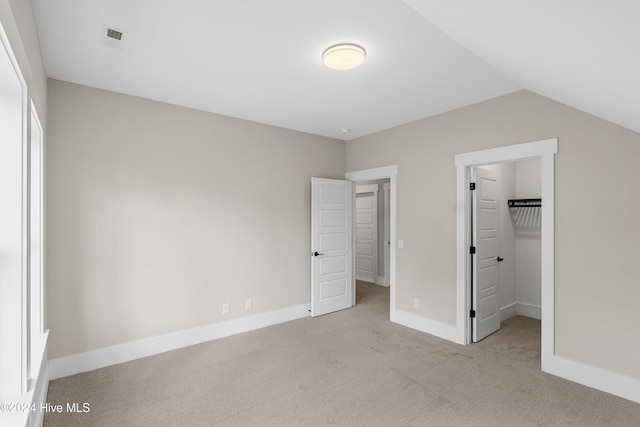 1105 Trisail Ter, Wilmington, NC 28412 - unfurnished bedroom with carpet, a spacious closet, a closet, baseboards, and vaulted ceiling