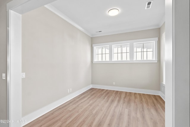 1105 Trisail Ter, Wilmington, NC 28412 - unfurnished room with ornamental molding, wood finished floors, and baseboards
