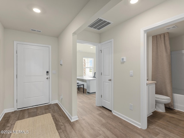 entryway with light hardwood / wood-style floors