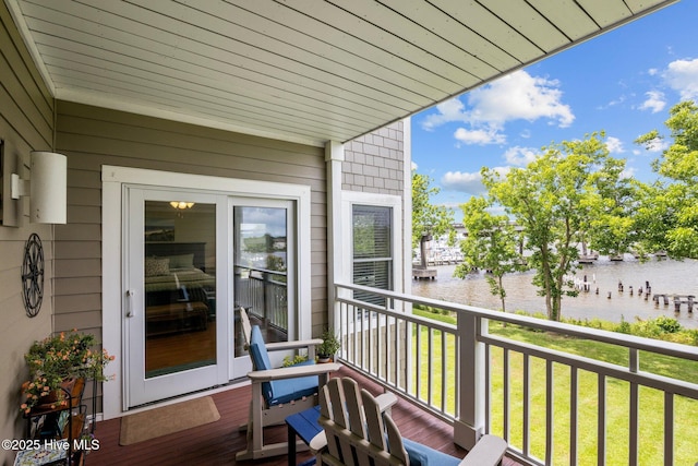 balcony featuring a water view