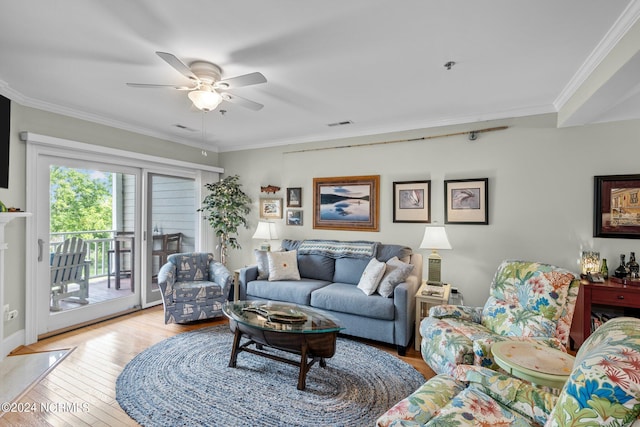 living room featuring ceiling fan, light hardwood / wood-style floors, and ornamental molding