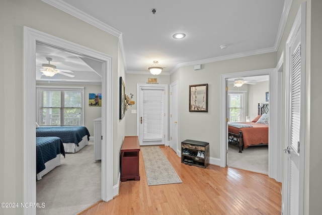 entrance foyer featuring plenty of natural light, ornamental molding, and ceiling fan