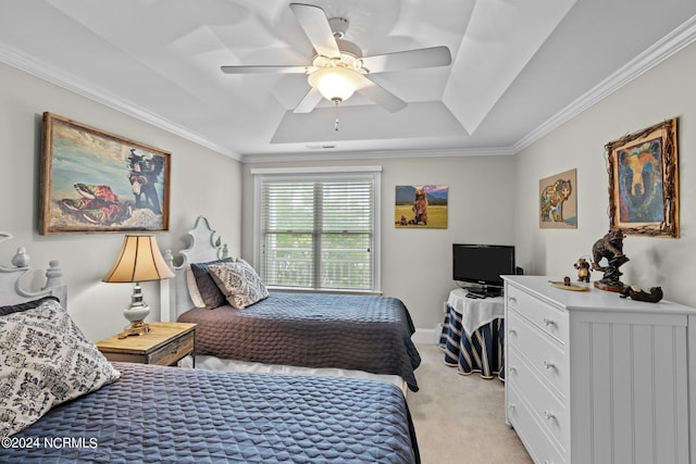 carpeted bedroom with a raised ceiling, ceiling fan, and crown molding