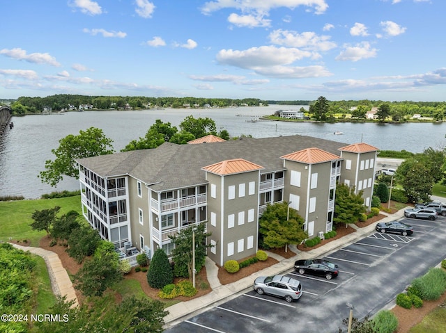 birds eye view of property featuring a water view