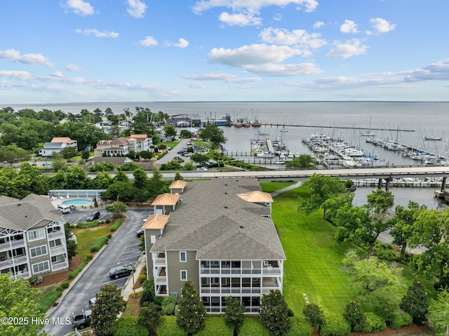 birds eye view of property with a water view