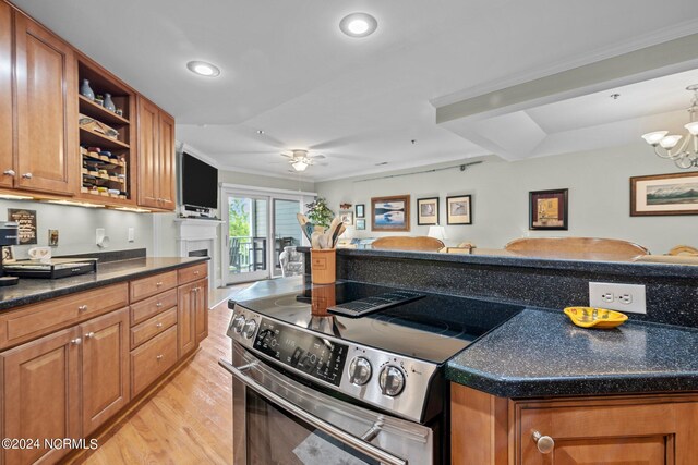 300 Midyette St Unit A8, Oriental, NC 28571 - kitchen with stainless steel range with electric cooktop, brown cabinets, light wood-style flooring, open shelves, and recessed lighting