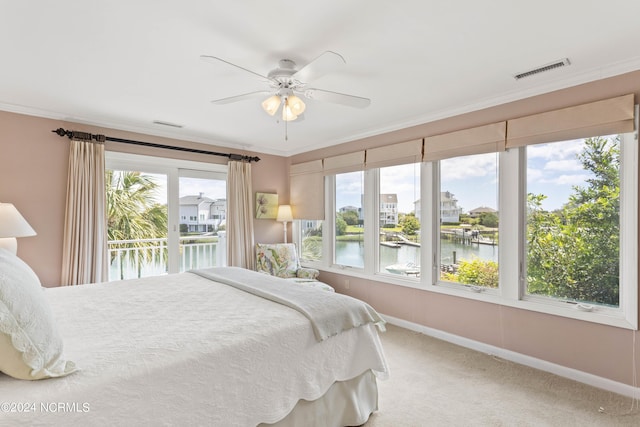 bedroom with carpet flooring, access to exterior, ceiling fan, a water view, and ornamental molding