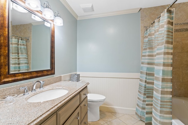 bathroom featuring tile patterned floors, vanity, toilet, and crown molding