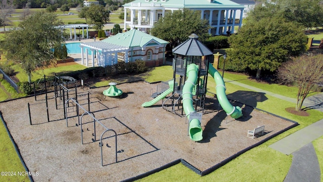 community playground with a yard and a pergola