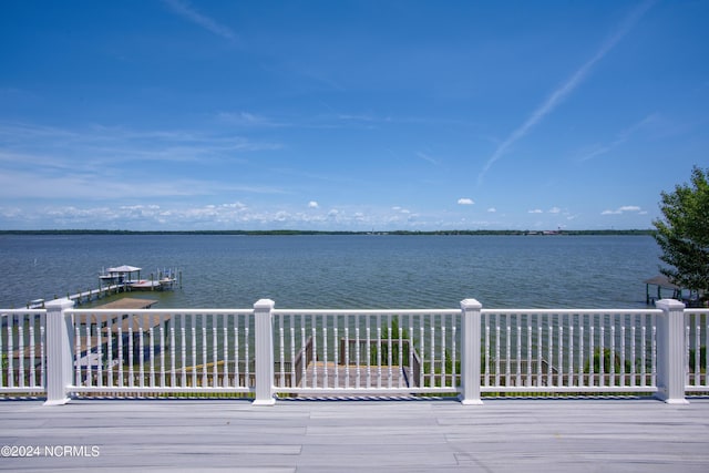 property view of water with a dock