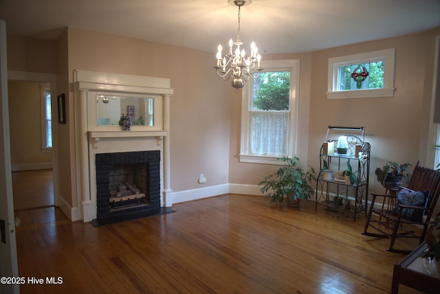 104 Rockingham St, Carthage, NC 28327 - living area featuring hardwood / wood-style flooring, a chandelier, and a brick fireplace