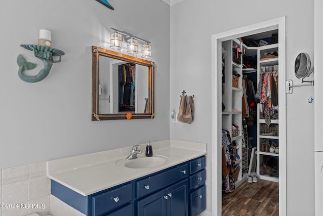 bathroom with vanity and hardwood / wood-style flooring