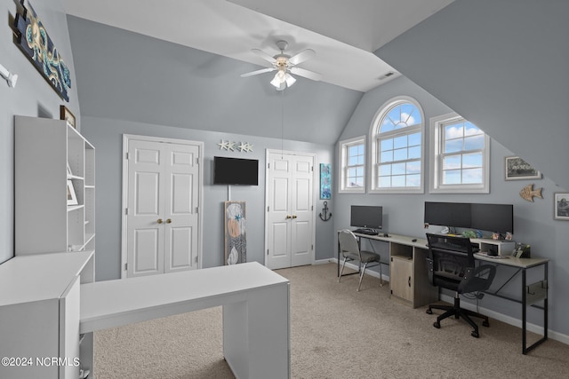 office area featuring ceiling fan, lofted ceiling, and light carpet